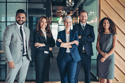 People in suits stood in a group