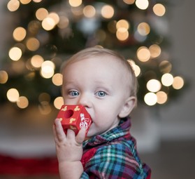 Baby in front of christmas tree