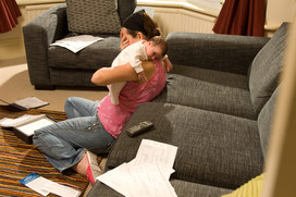 Person surrounded by bills