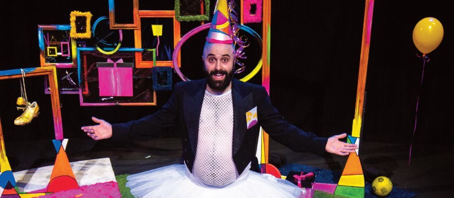 Party image- man in tutu wearing party hat