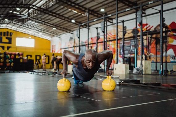 Man working out with kettle bells