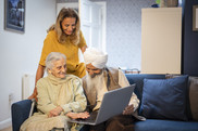 Family looking at laptop