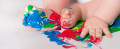 baby with paint on feet