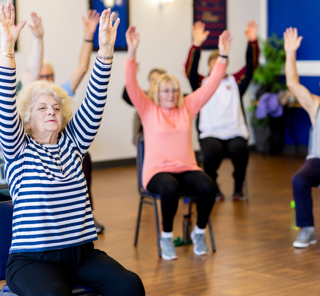 Older persons doing chair based exercises