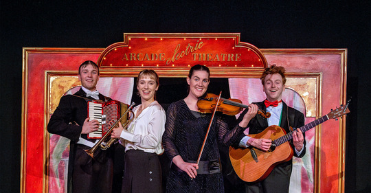 actors with musical instruments all smiling