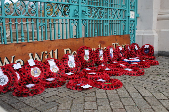 Wreaths laid in front of embankment War memorial