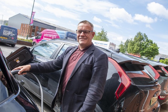 john e wright employee with charger