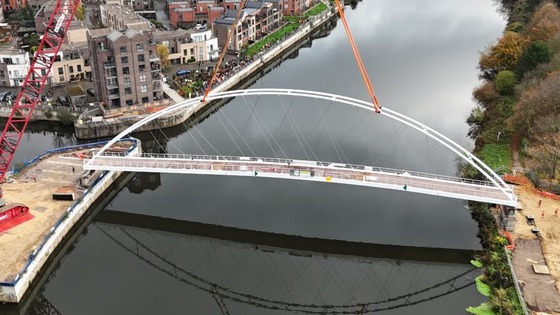 New river Trent footbridge being lifted into place by a large crane