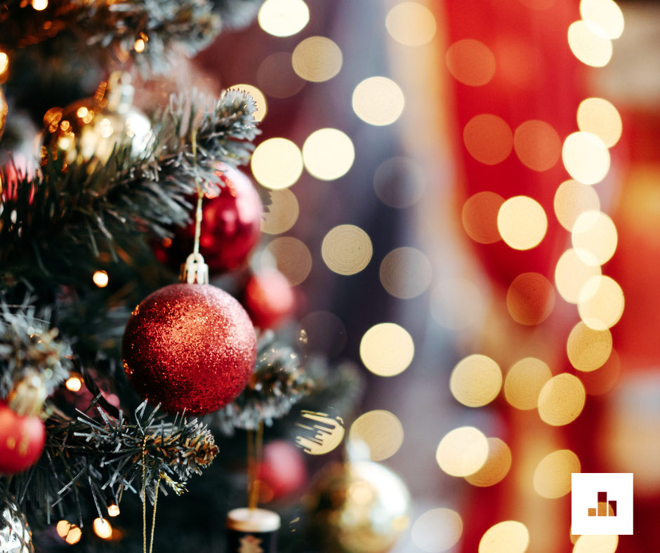 Christmas tree with snow and red baubles on it