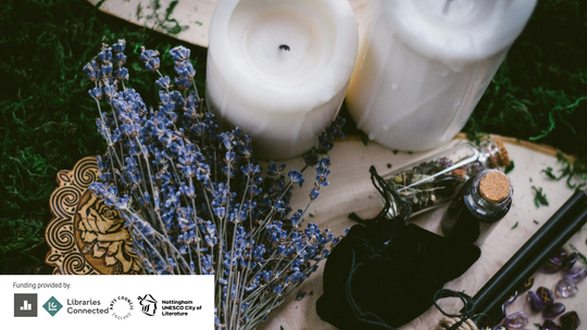 Candles and lavender on a table.