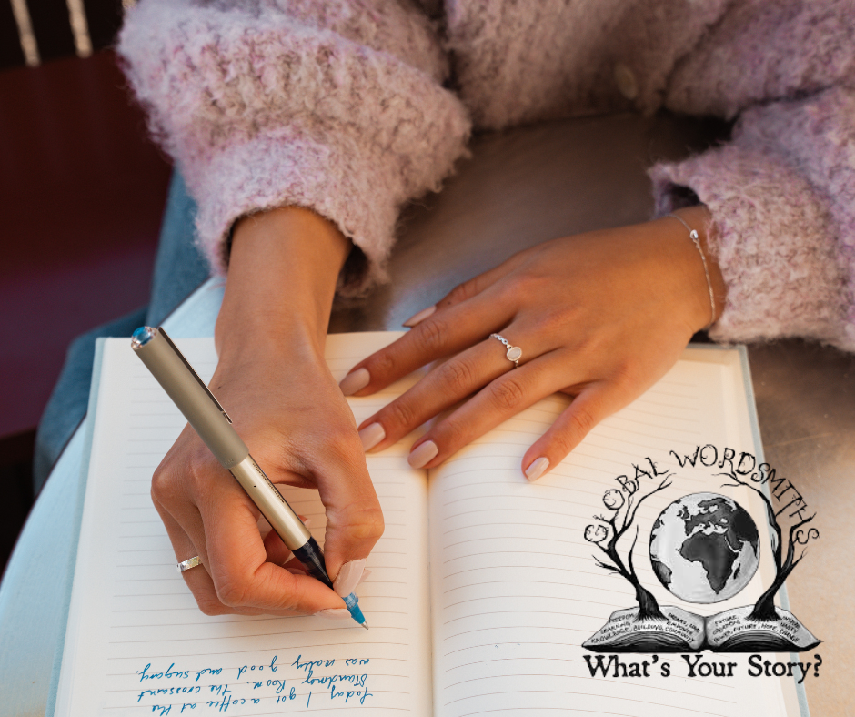 a female holding a pen and writing in a notebook with a fountain pen