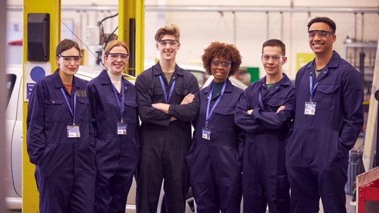 Young people in engineering overalls