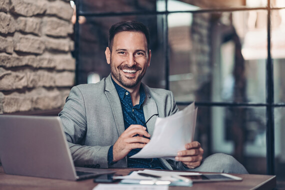 smart man behind laptop