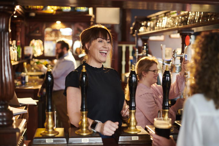 casual bar staff serving customers