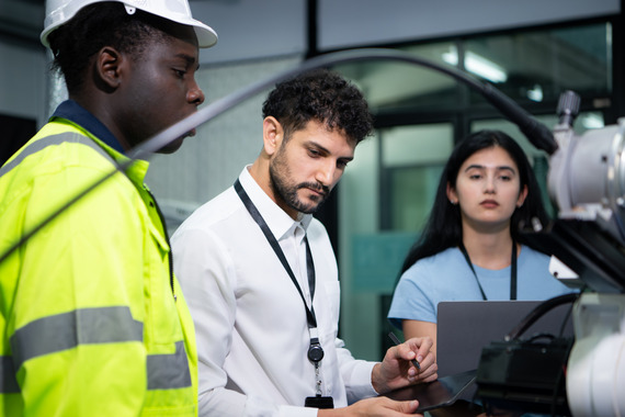 Technical supervisor liaising with colleagues