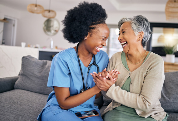 at-home carer holding hands with resident