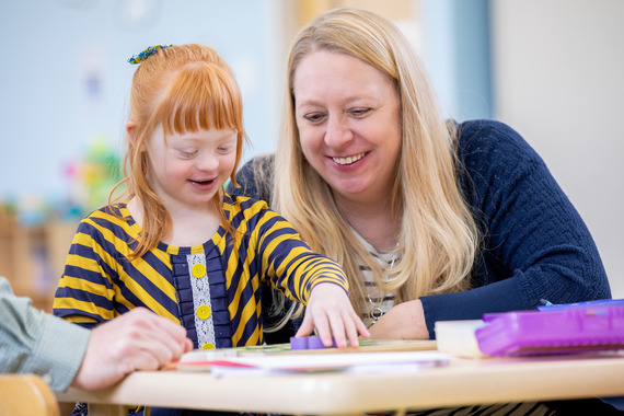 Teacher with young learner