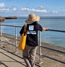 Duang in her NHS App tshirt at the seaside beach