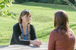 Nurse talking to someone outside