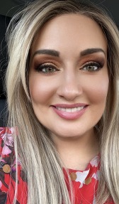 Headshot image of a female with blonde hair