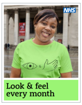 A Black lady with short black wearing a green T-shirt featuring an eye and hand symbol in Manchester