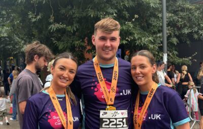 2 girls and one boy have completed a race and have medals round their neck