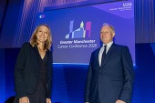 Paula Radcliffe and Professor Peter Johnson on stage at the Cancer Conference