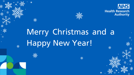 Blue background, snowflakes and the text Merry Christmas and a Happy New Year