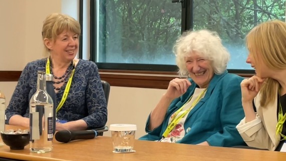 Three people sitting on a panel discussion