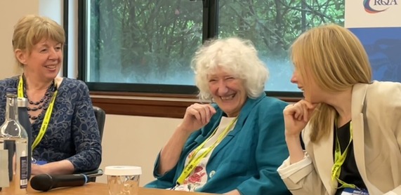 Three people sitting on a panel discussion