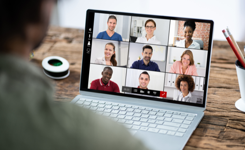 Image of a laptop and an online meeting