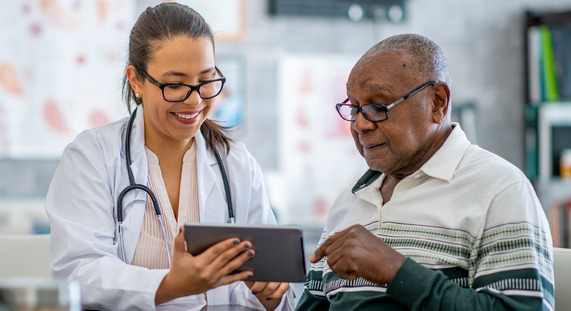 Two people looking at information on a screen