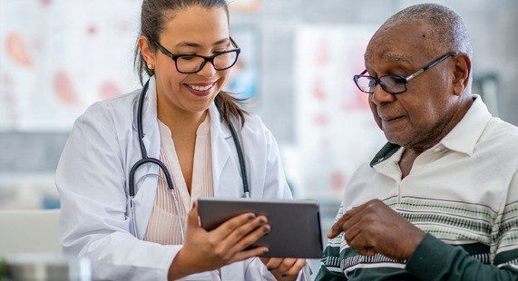 Two people looking at information on a screen