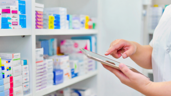 pharmacy and hand with ipad