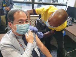 Mark Lam receiving his seasonal jab