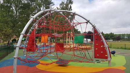 Image of the Spiderweb with the sand play in the background