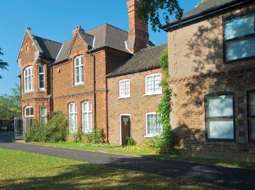 A photograph of the rear aspect of the museum from the gardens