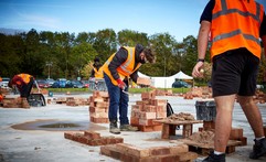 Bricklayers working with masks and socially distanced