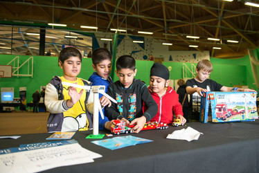 Young people building with lego 