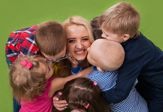 Childminder with a group of children.