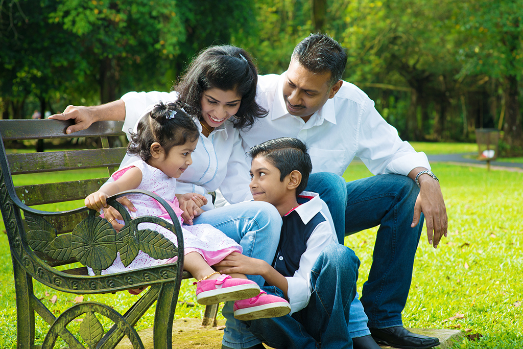 Picture of a family together at a park 