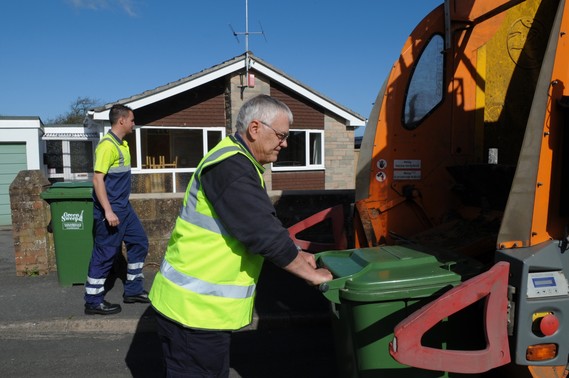 loading green bins