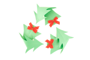 Recycling symbol set out in holly leaves