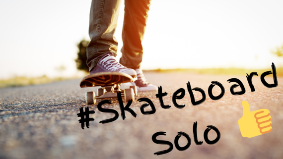 Skateboarder's legs and board