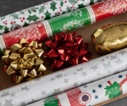 Rolls of Christmas wrapping paper and ribbon