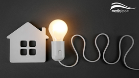 Graphic showing home and lightbulb to represent energy