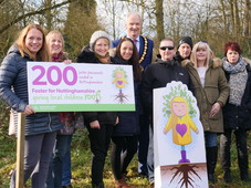 Foster carers stood with Councillor Rostance at Sherwood Forest event