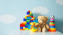Toys in front of cloud wallpaper
