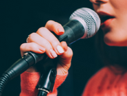 A woman at a microphone