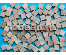 Vaccine written on wooden tiles
